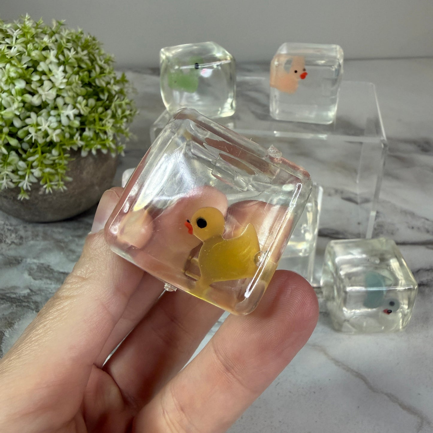 Squishy Toy - Ice Cube Glow In The Dark Duck-on hand