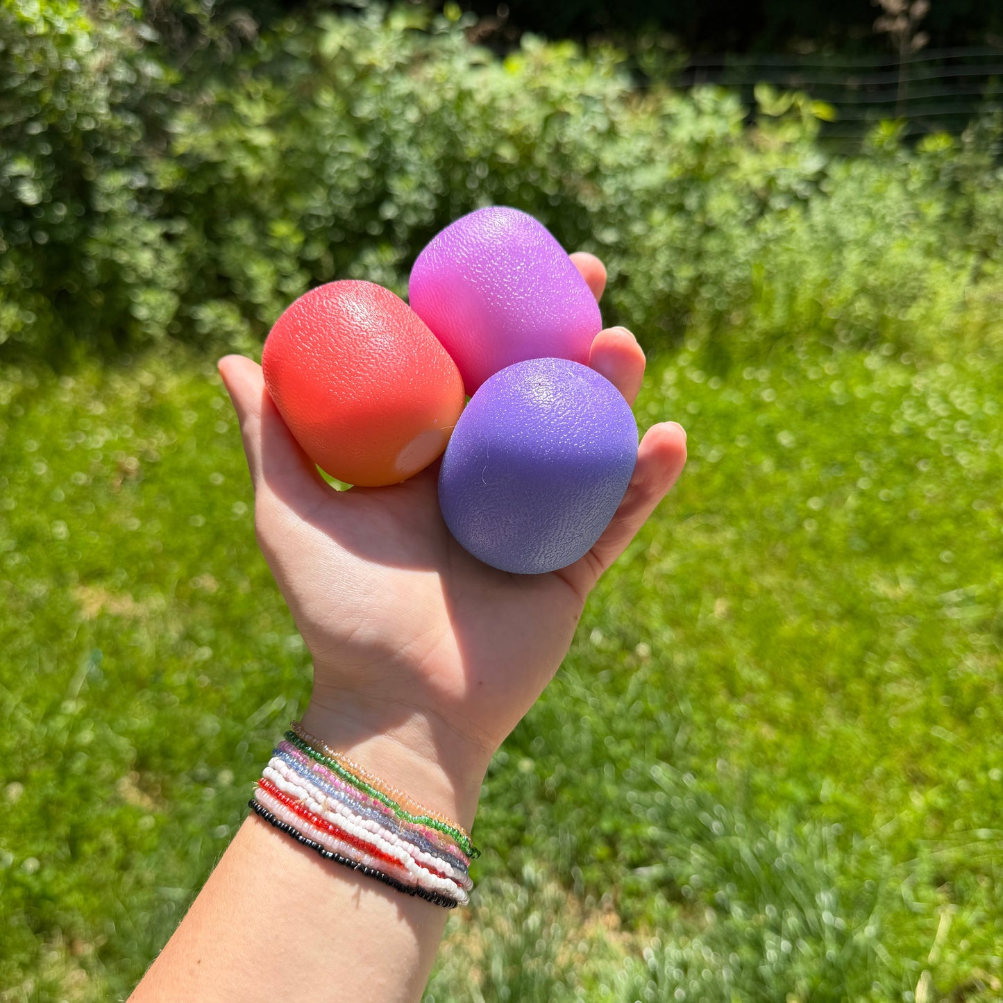 Squishy Toy - Sunlight Color Changing Gumdrop-on hand