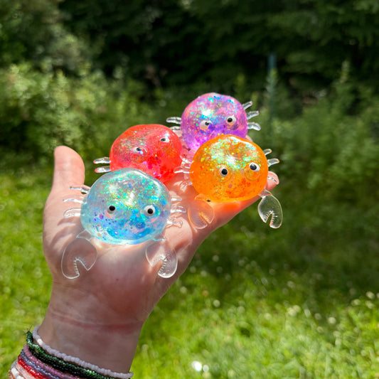 Squishy Toy - Glitter Crab-on hand
