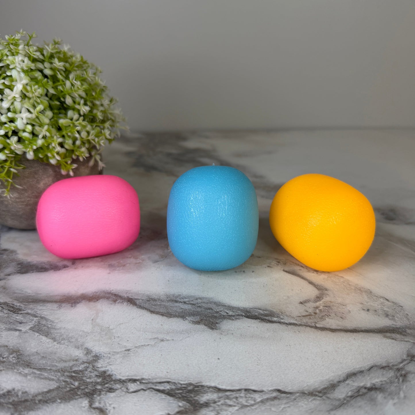 Squishy Toy - Sunlight Color Changing Gumdrop-on hand