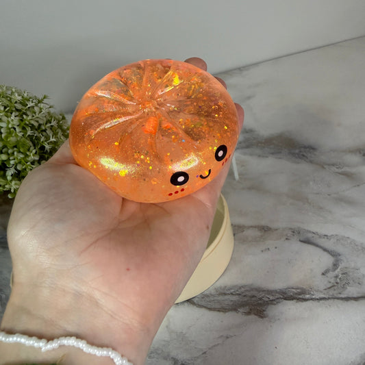 Squishy Toy - Viral Dumpling, Slow Rise Glitter - Light Orange-on hand