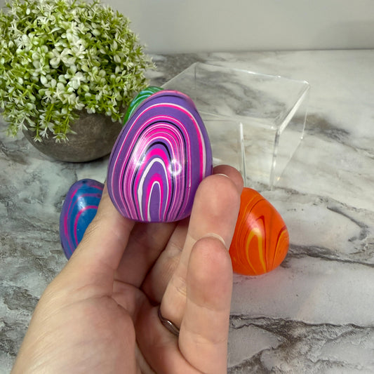 Squishy Toy - Teardrop Marble-on hand