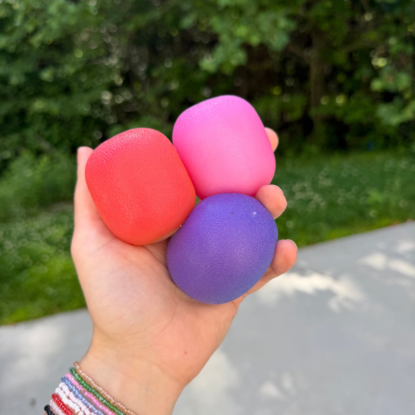 Squishy Toy - Sunlight Color Changing Gumdrop-on hand
