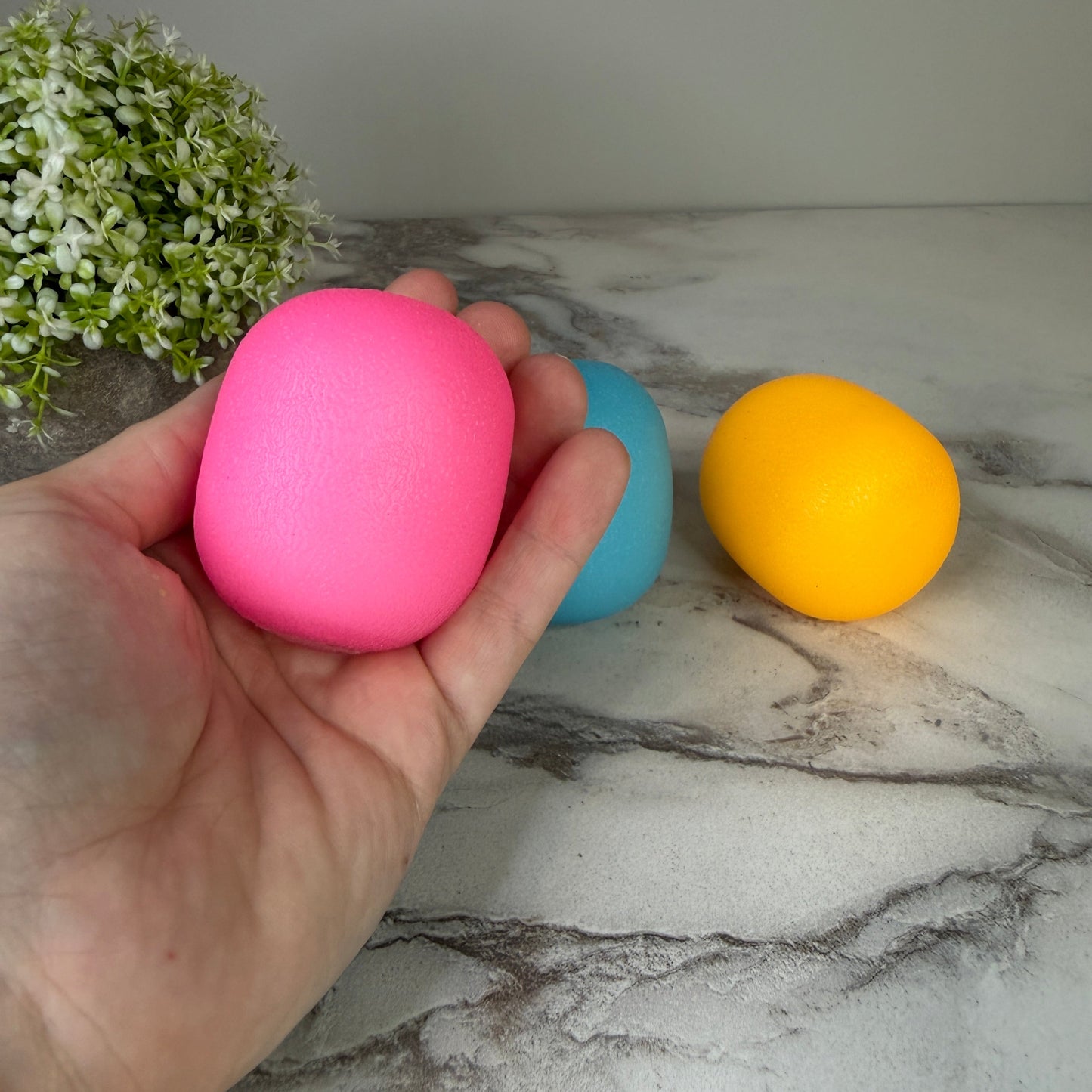 Squishy Toy - Sunlight Color Changing Gumdrop-on hand