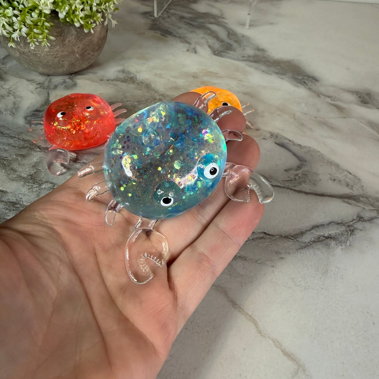 Squishy Toy - Glitter Crab-on hand