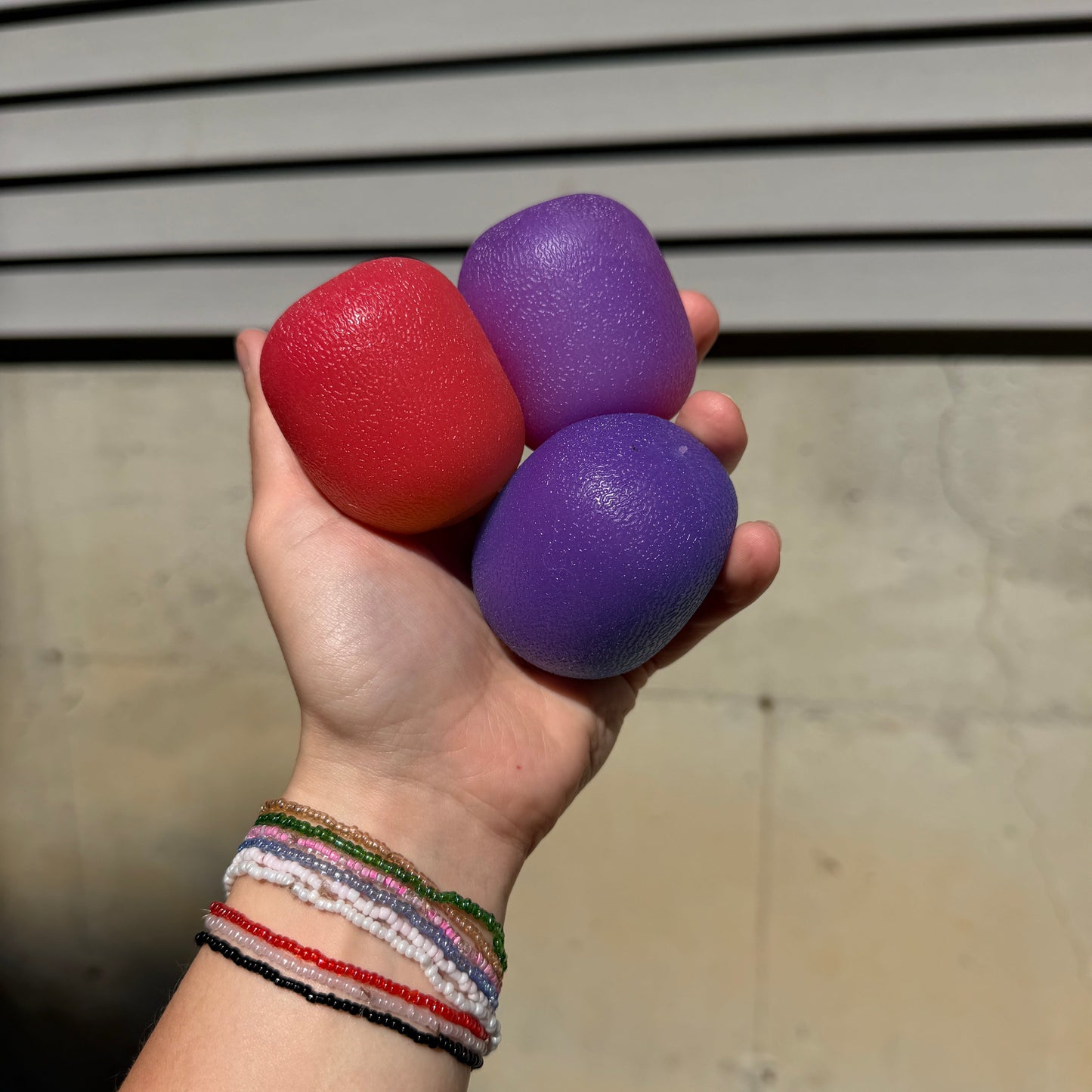 Squishy Toy - Sunlight Color Changing Gumdrop-on hand