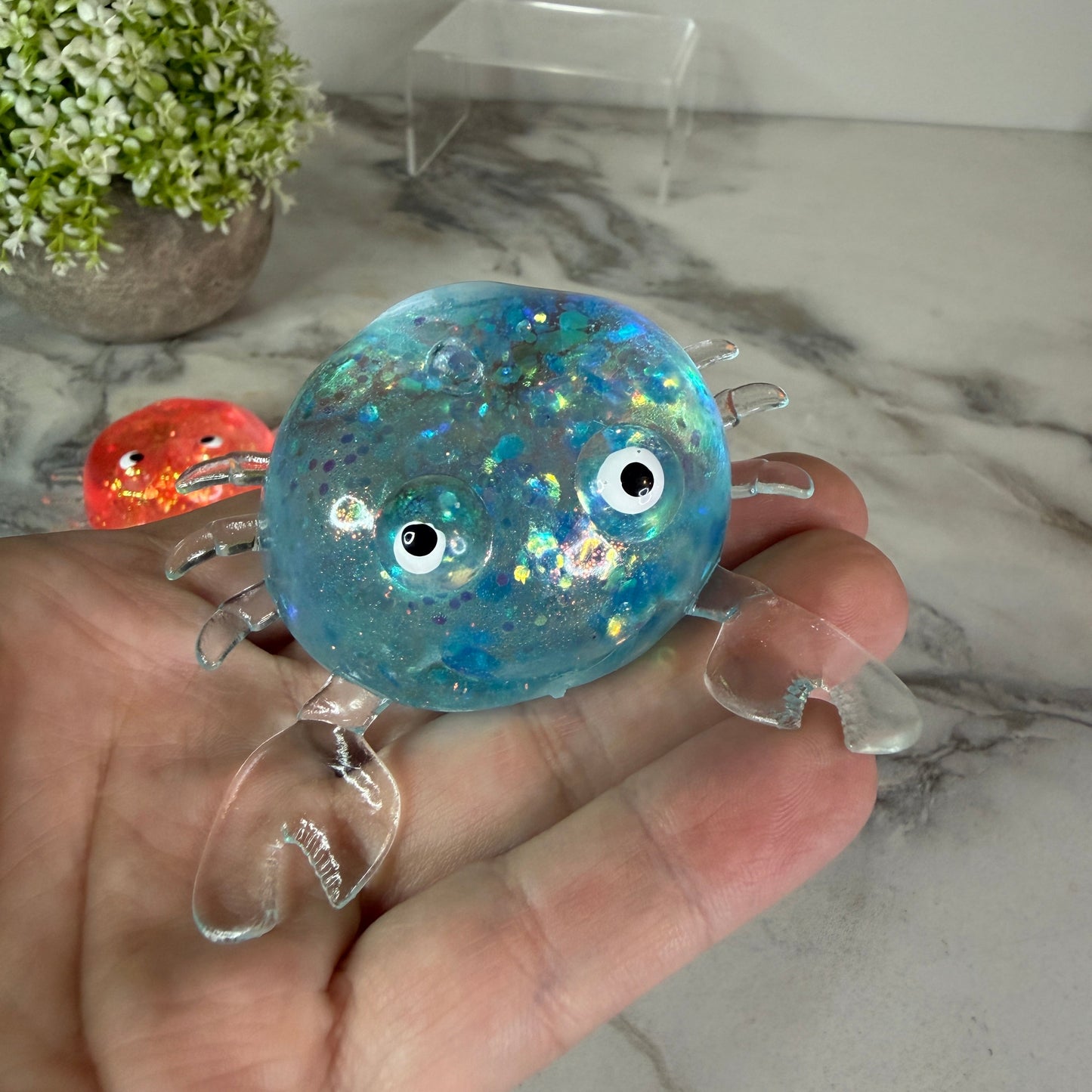 Squishy Toy - Glitter Crab-on hand
